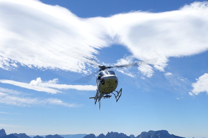 Helicopter scenic flight in the blue sky
