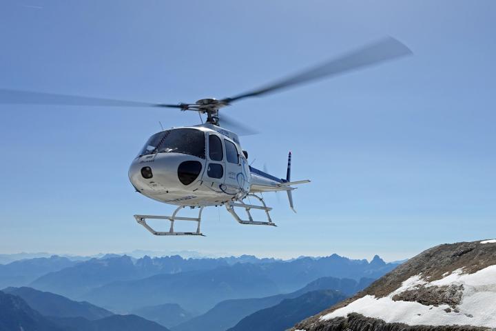 You will flying over a snow covered mountain