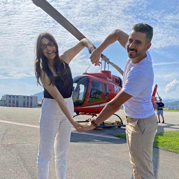 This happy couple shows their positive expression with a big heart.