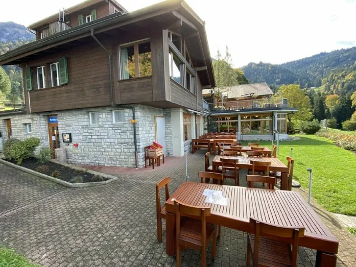 a house with a mountain in the background