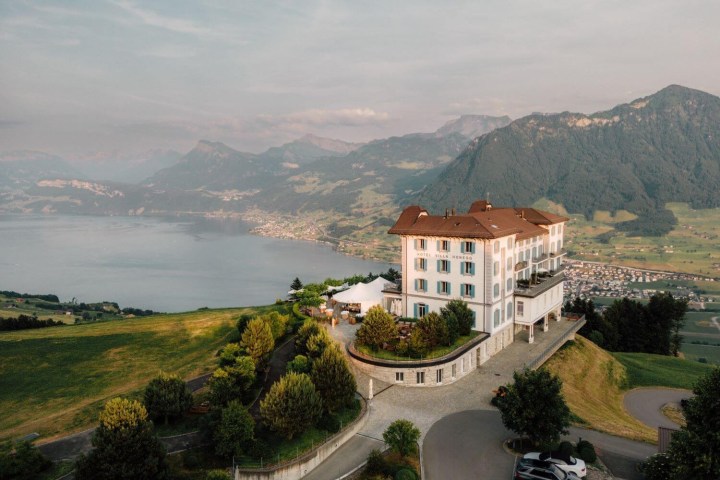 a view of a house with a mountain in the background