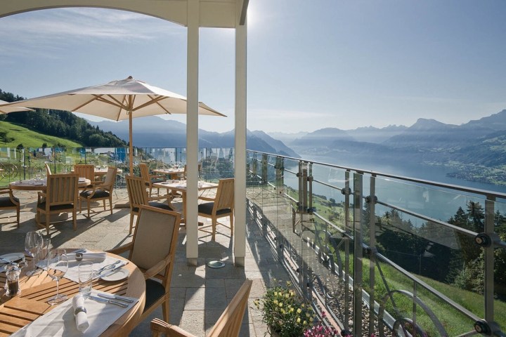 a view of a large building with a mountain in the background