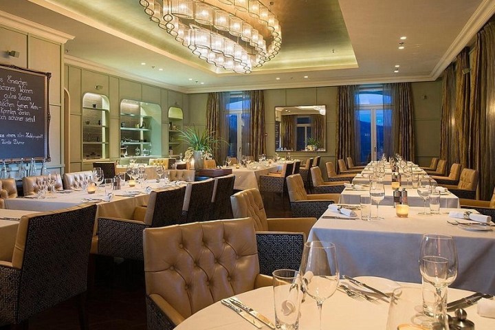 a dining room table in front of a window