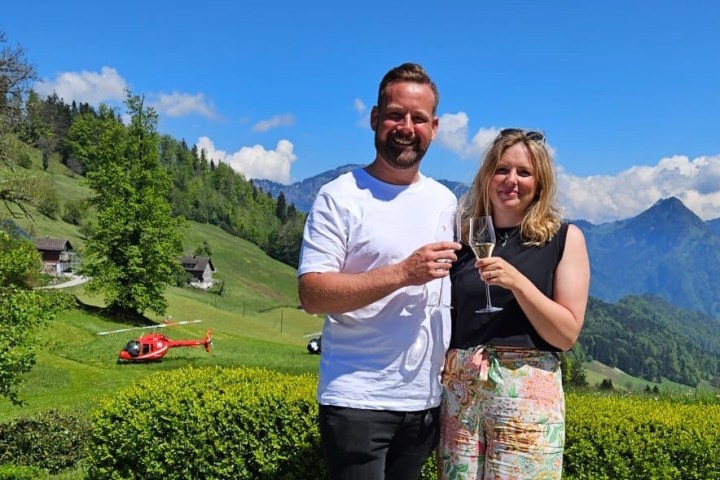 a man standing in front of a mountain