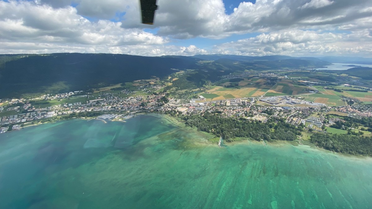 a body of water with a mountain in the background