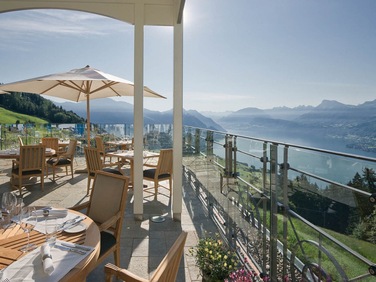 a view of a large building with a mountain in the ocean