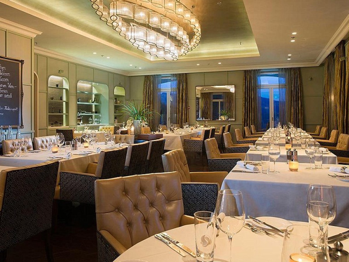 a dining room table in front of a window