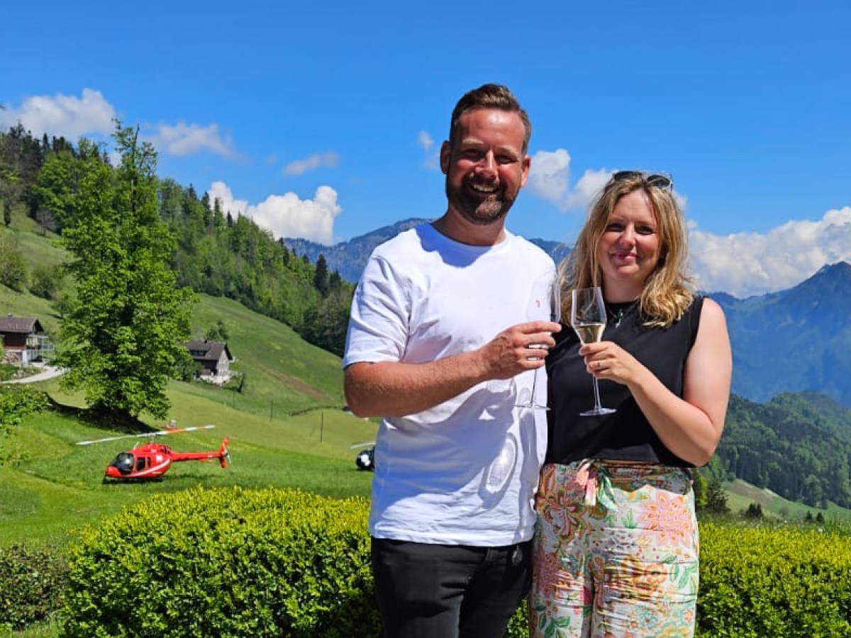 a man standing in front of a mountain
