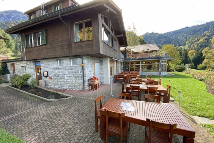 a house with a mountain in the background