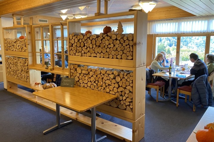 a group of people sitting at a table in a room